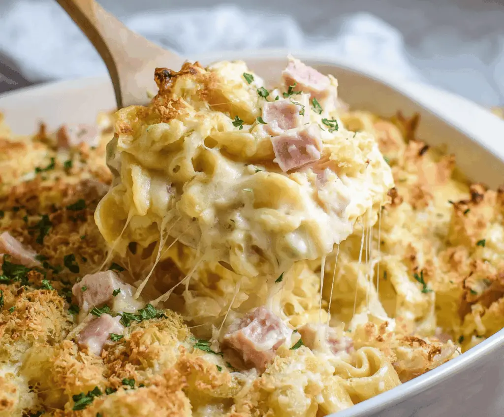 Delicious Chicken Cordon Bleu Casserole with breaded chicken, ham, Swiss cheese, and creamy sauce, baked to perfection.