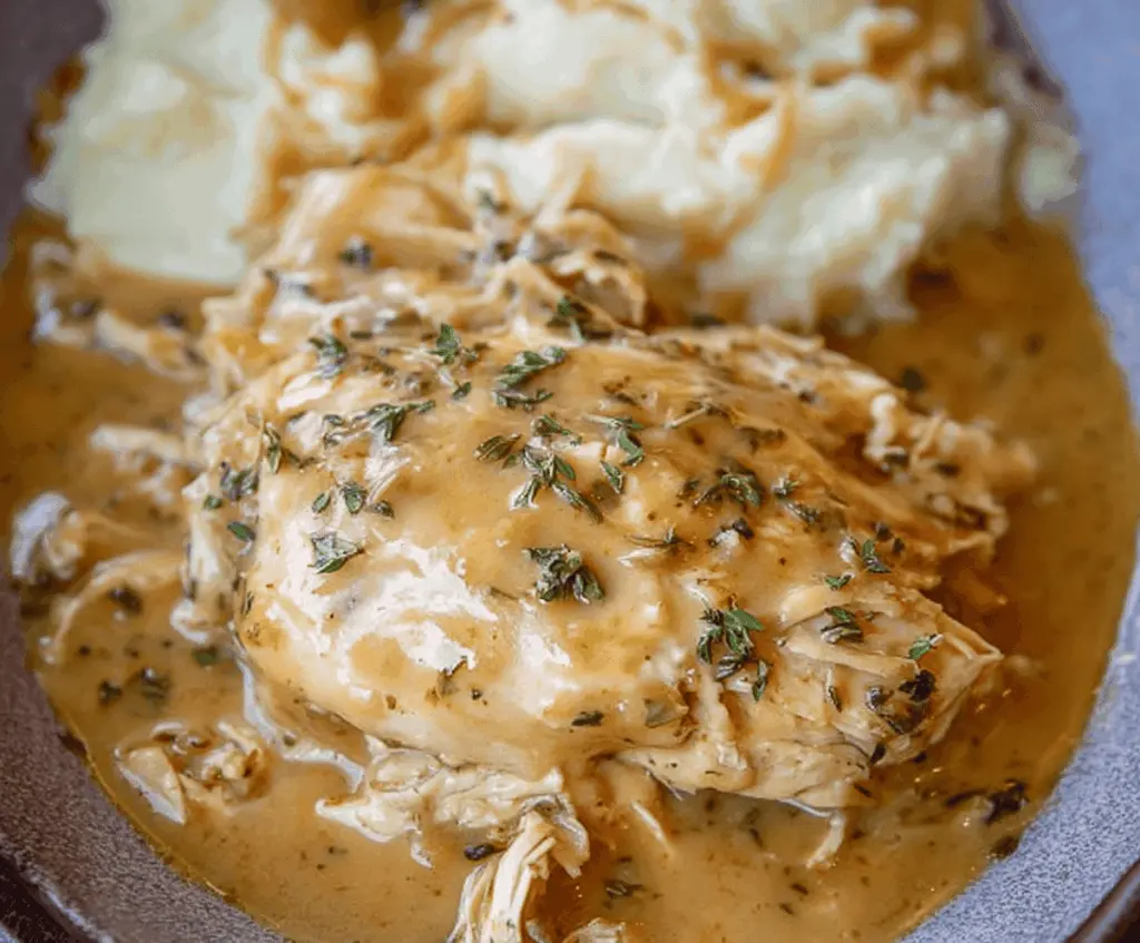 Delicious homemade Crockpot chicken cooked with savory gravy, perfect for an easy and flavorful meal