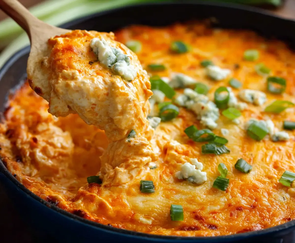 Creamy Buffalo Chicken Dip served with celery and tortilla chips, perfect for parties and snacks.